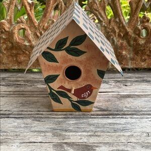 Rustic Tan Birdhouse with Green Foliage Accents